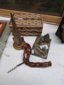 A corkscrew, thermometer, sewing basket