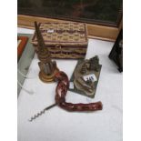 A corkscrew, thermometer, sewing basket