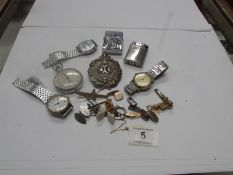 A mixed lot of watches, cigarette lighte