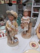 A pair of bisque figures, a/f