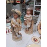 A pair of bisque figures, a/f