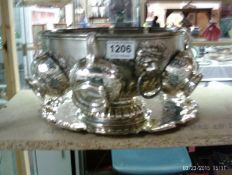 A silver plated punch bowl and 6 cups