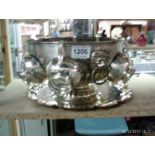 A silver plated punch bowl and 6 cups