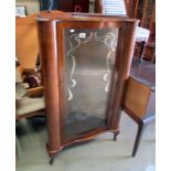 A 1960's corner china cabinet