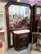 A mahogany marble top cabinet with large