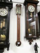 A Victorian inlaid stick barometer by F