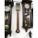 A Victorian inlaid stick barometer by F