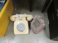 A vintage telephone and one other item