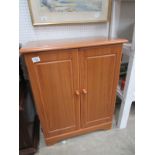 A modern teak CD/DVD cabinet