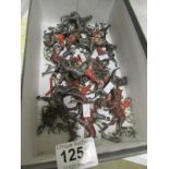 A quantity of fox hunting toy figures in