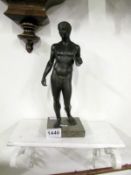 A bronze nude male on marble base