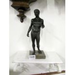 A bronze nude male on marble base