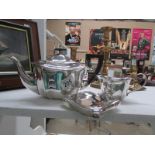 A silver plate teapot, milk jug and hip