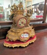 A French mantel clock with porcelain pan