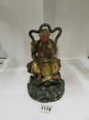 A Chinese gilded carved wood figure, 9"