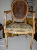 A salon chair with cane back
