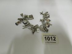 A silver charm bracelet with approximate