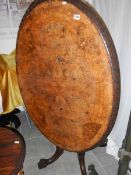 A Victorian oval inlaid mahogany loo tab