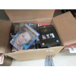 A box of DVD's and videos