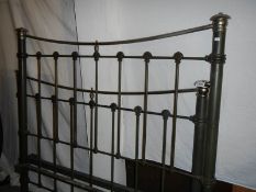 A Victorian brass and iron bedstead