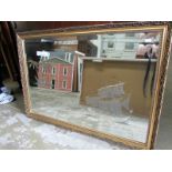 A gilt framed etched mirror