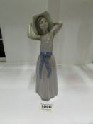 A LLadro girl with large bow on dress