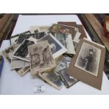 A quantity of postcards and photographs