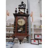 A mahogany wall clock