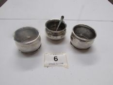 A silver mustard pot with spoon and 2 si