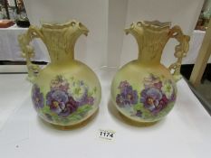 A pair of Austrian ewers decorated with