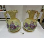 A pair of Austrian ewers decorated with