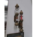 A pair of brass candle wall lamps stampe