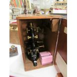 A cased W Watson & Sons microscope with