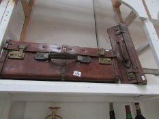2 old leather suitcases