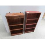 2 stained pine book shelves