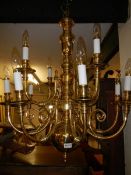 A heavy 12 lamp brass ceiling light