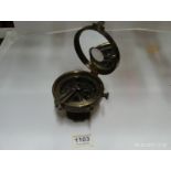 A silvered brass compass marked Elliot B