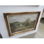 A gilt framed country scene