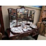 A mahogany dressing table with triple mi