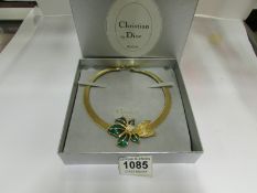 A Christian Dior yellow metal with ename