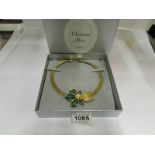 A Christian Dior yellow metal with ename