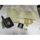 A Civil Defence medal with certificate a