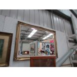 A gilt framed mirror