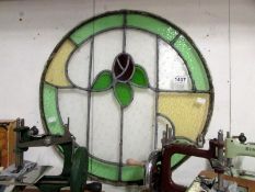 A circular leaded and stained glass wind