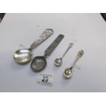 A silver souvenir spoon and 3 others