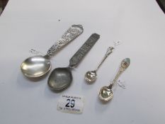 A silver souvenir spoon and 3 others