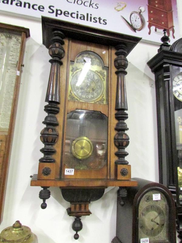 A brass faced wall clock