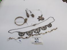 A silver brooch, silver bracelet, earrin