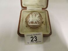A cameo brooch dated 1939 being the Thre