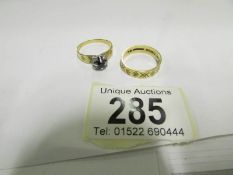 An 18ct gold wedding band and an 18ct go
